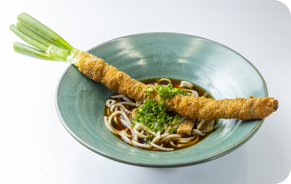 ネギまるごと一本肉巻き うどんの写真