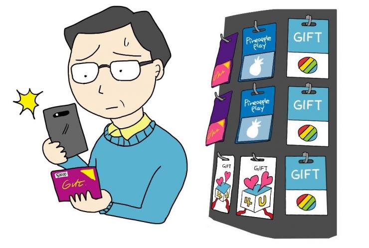 詐欺的な請求にだまされプリカ番号を写真に撮って送ろうとしている男性